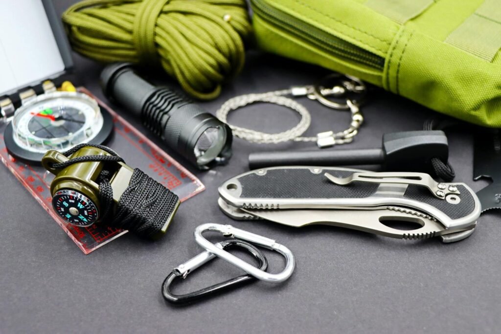 Outdoor Gear That Actually Holds Up in Harsh Conditions 4 A detailed flat lay of essential survival tools for outdoor adventure and tactical use.