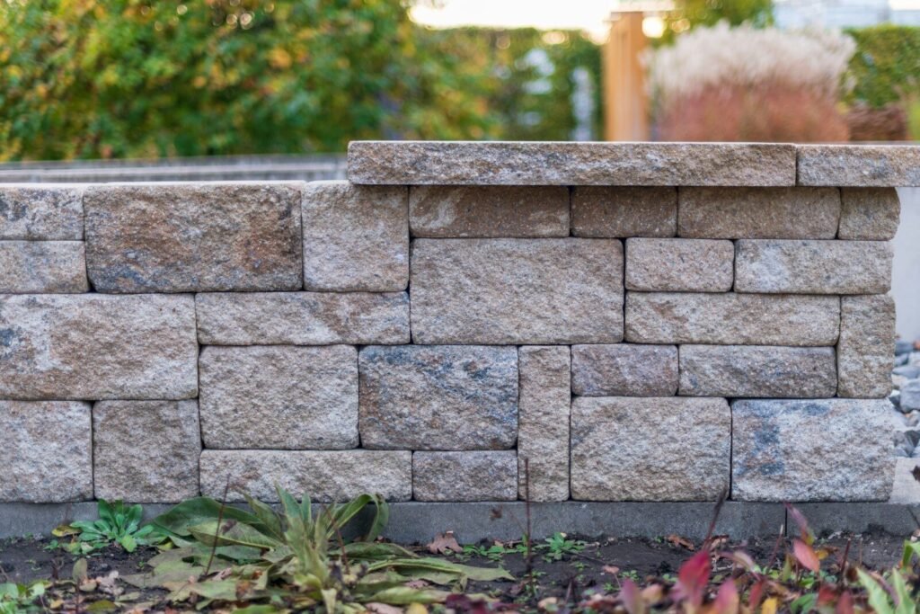 Stone wall with plants in the foreground