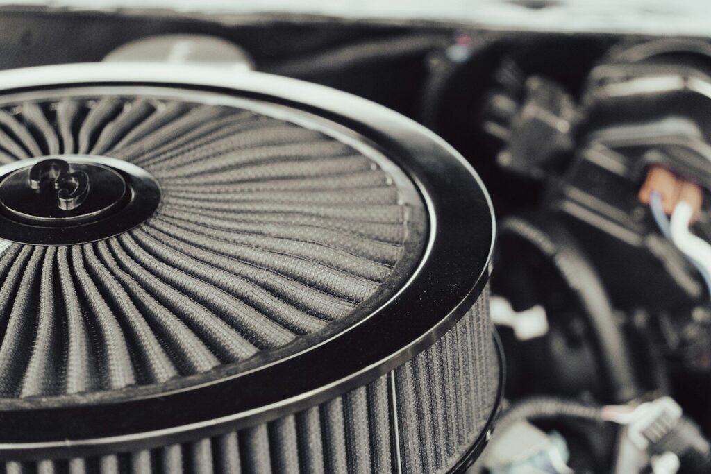 A close up of a car engine with the hood up