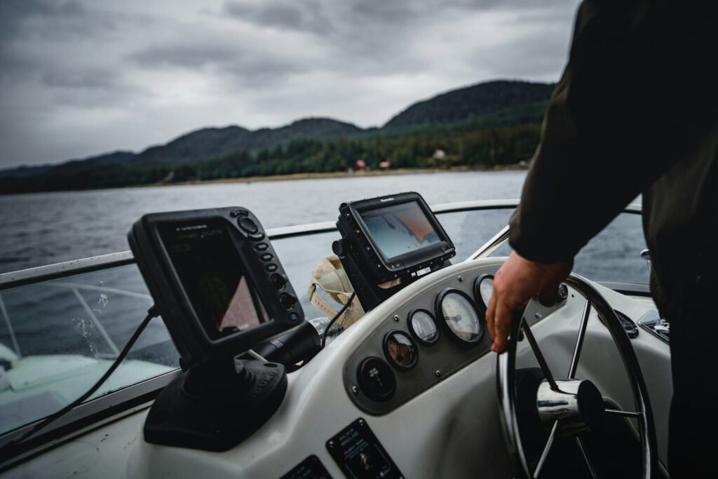 person driving ski boat during day