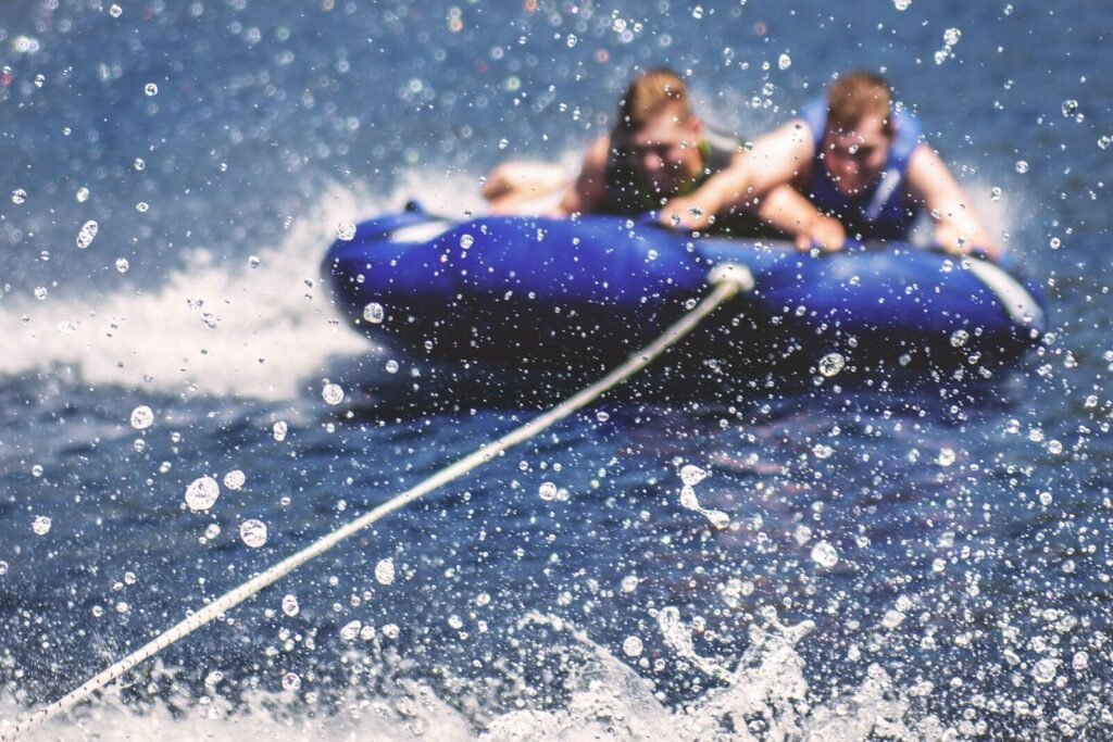 two men riding on inflatable boats