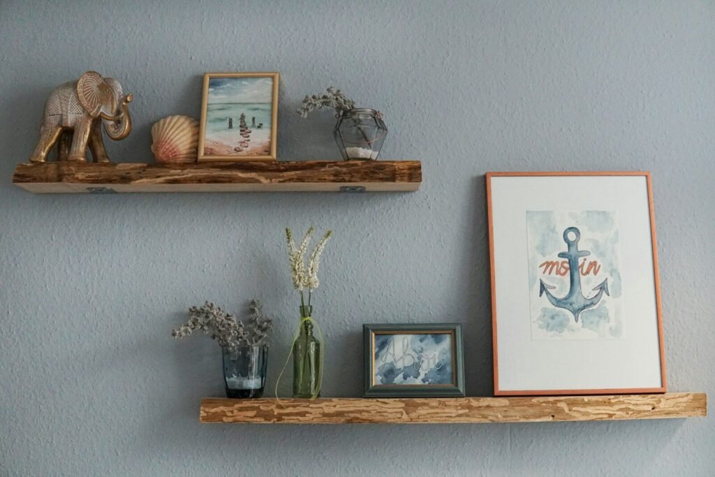 How to Build Floating Shelves; white flowers in clear glass vase on brown wooden wall shelf
