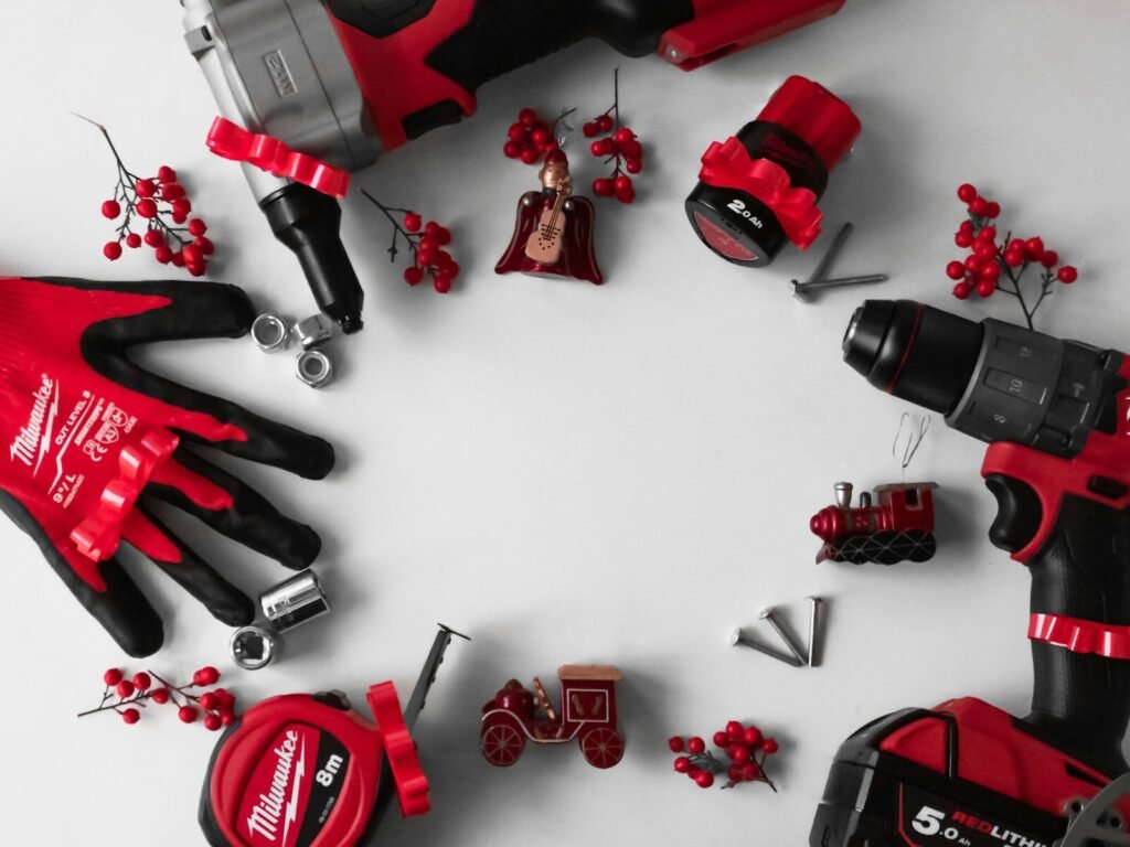 Milwaukee vs. DeWalt; a group of red and black tools on a white surface