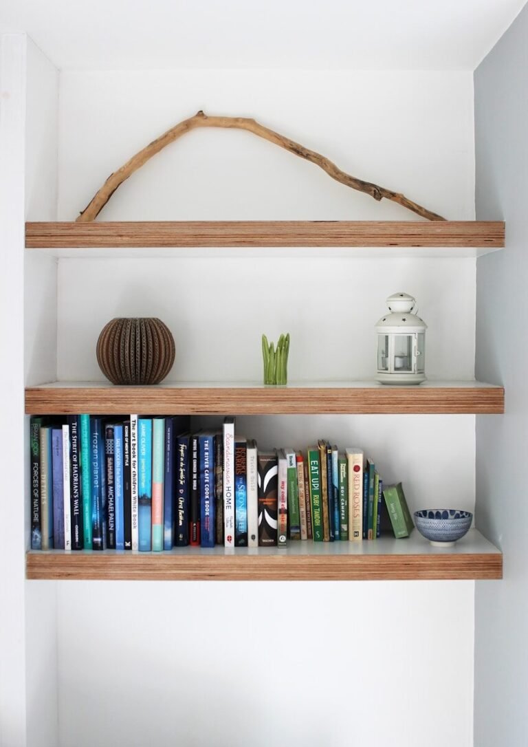 How to Build Floating Shelves; books on brown wooden shelf